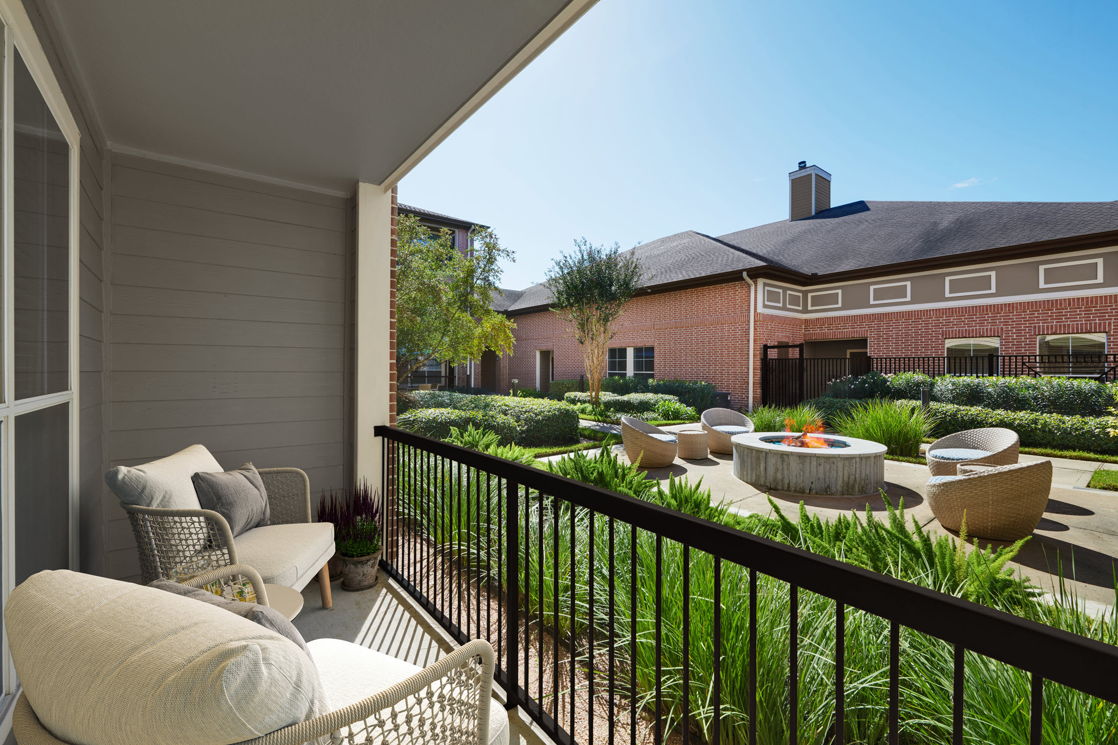 Patio overlooking Outdoor Fire Pit Courtyard at Camden Royal Oaks Apartments in Houston Texas